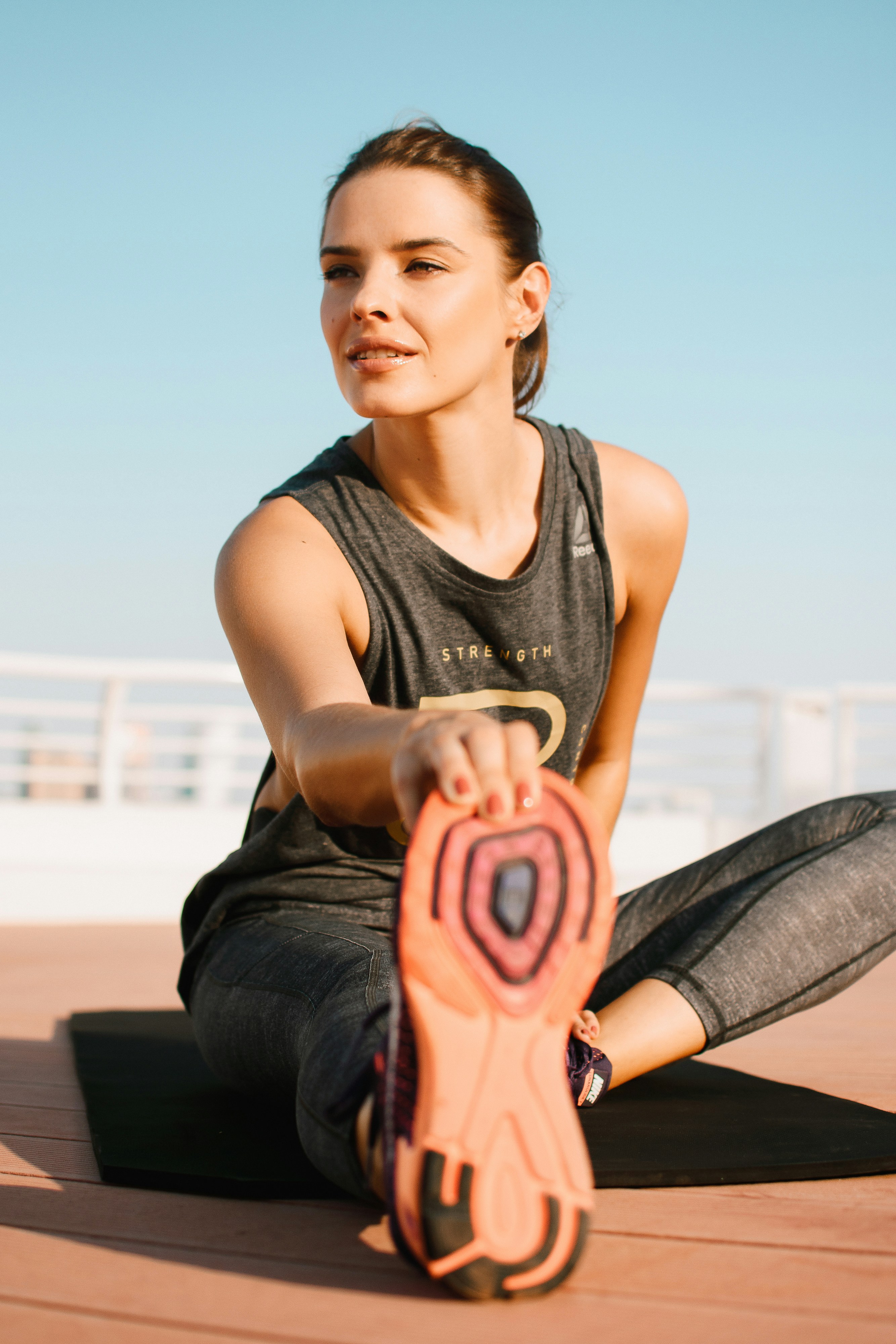 Woman stretching before a strength workout
